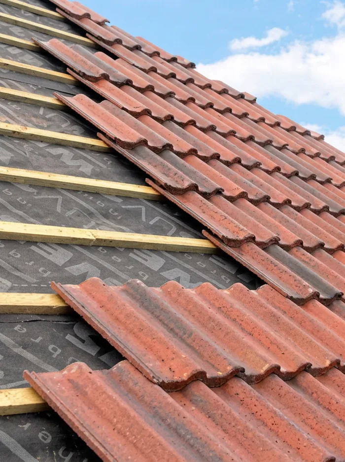 Completed red tiled roof on a 1930s semi-detached house